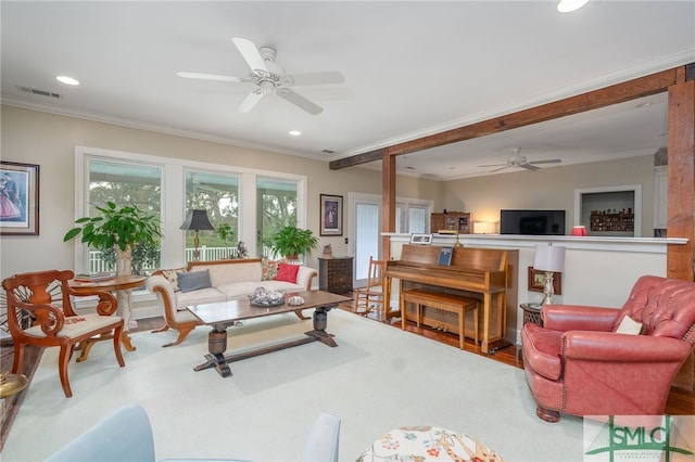 living room featuring ornamental molding, recessed lighting, visible vents, and wood finished floors