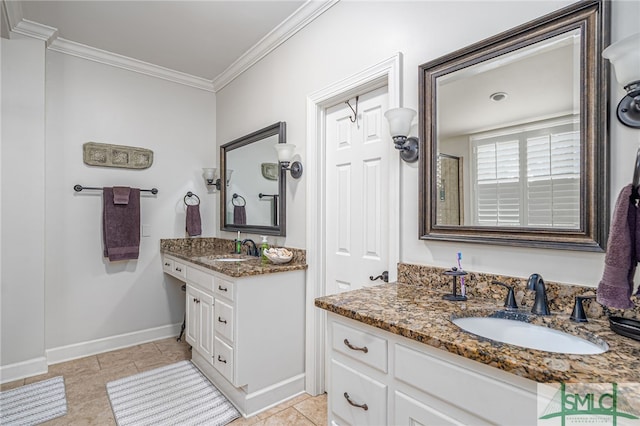 full bathroom with crown molding, baseboards, two vanities, and a sink