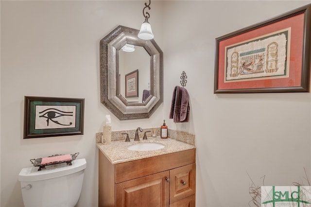 half bath with vanity and toilet