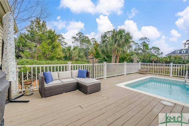 view of swimming pool with a deck, outdoor lounge area, and a fenced in pool