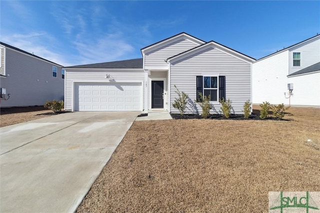 ranch-style home with a garage, driveway, and a front yard