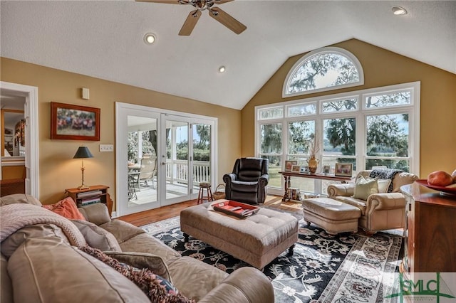 living room with french doors, recessed lighting, a ceiling fan, vaulted ceiling, and wood finished floors