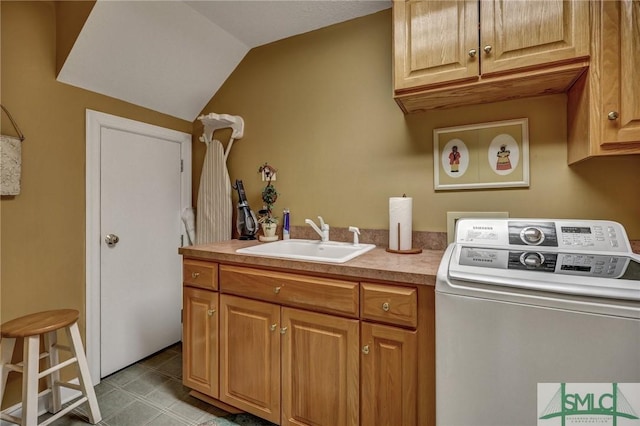 laundry area with cabinet space, washer / clothes dryer, a sink, and light tile patterned flooring