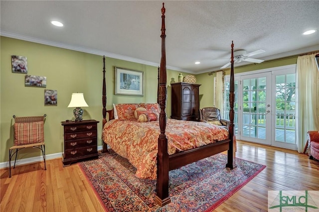 bedroom with access to outside, crown molding, light wood-style flooring, and baseboards