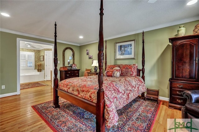 bedroom featuring baseboards, light wood-type flooring, and crown molding