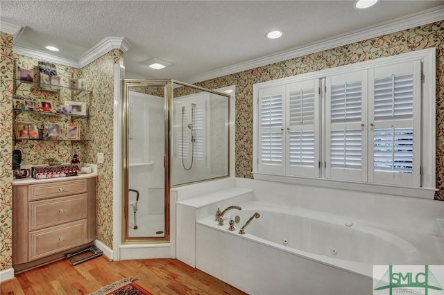 full bathroom featuring wallpapered walls, crown molding, wood finished floors, and a stall shower