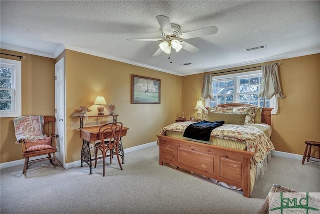 bedroom with a textured ceiling, light carpet, visible vents, baseboards, and crown molding