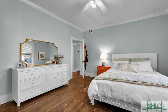 bedroom featuring dark wood-style flooring, a ceiling fan, baseboards, visible vents, and crown molding