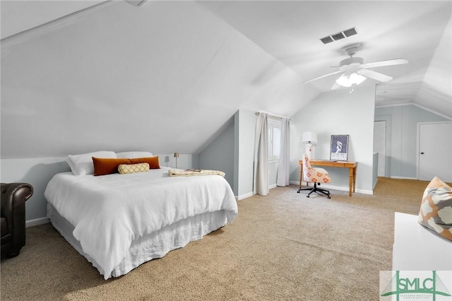 carpeted bedroom with lofted ceiling, baseboards, visible vents, and a ceiling fan