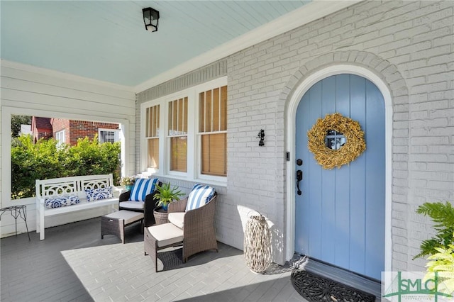 property entrance with brick siding