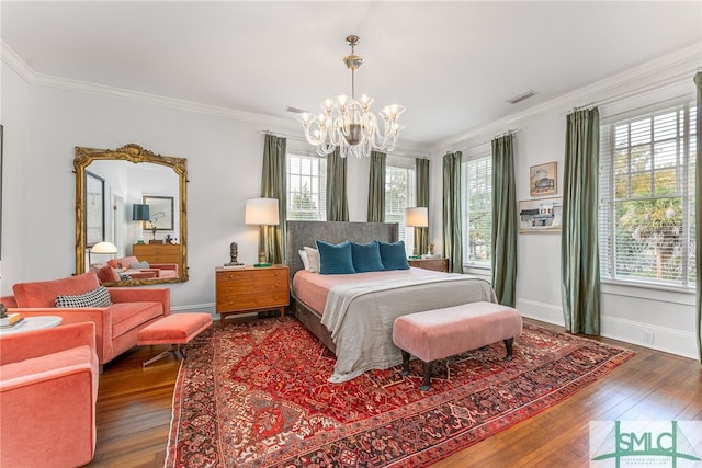 bedroom with wood-type flooring, multiple windows, and crown molding