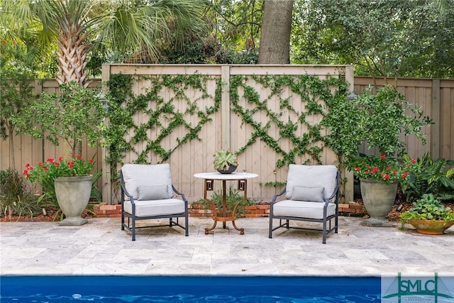 view of patio with a fenced backyard and a fenced in pool