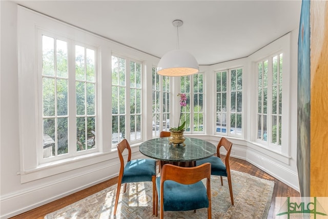 sunroom / solarium featuring a healthy amount of sunlight