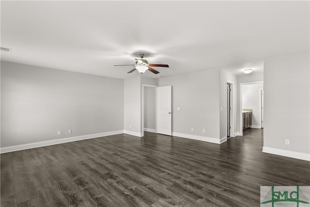 interior space featuring dark wood-style floors, ceiling fan, and baseboards