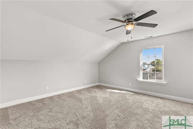 bonus room featuring vaulted ceiling, carpet floors, visible vents, and baseboards