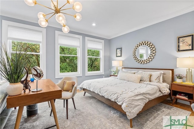 bedroom with ornamental molding, multiple windows, and a notable chandelier