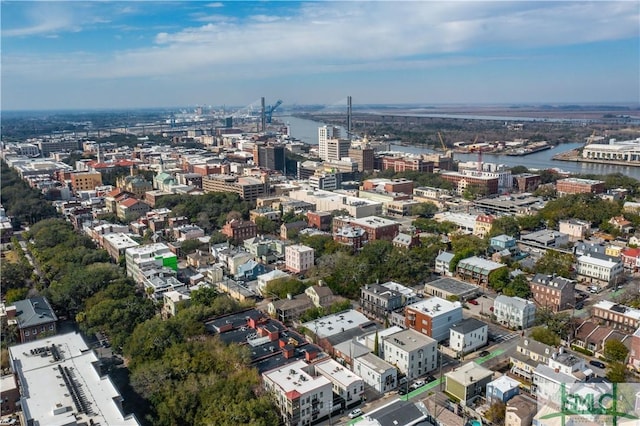 birds eye view of property with a water view and a city view