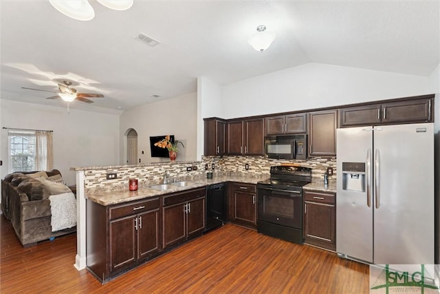 kitchen featuring dark wood finished floors, visible vents, open floor plan, a sink, and black appliances