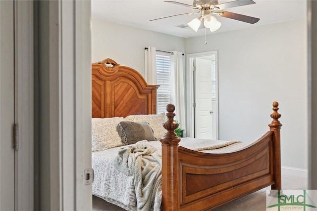 bedroom with a ceiling fan and baseboards