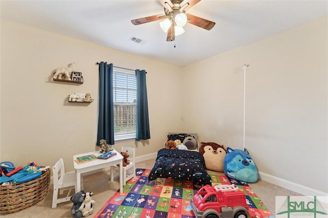 rec room with carpet flooring, ceiling fan, and baseboards