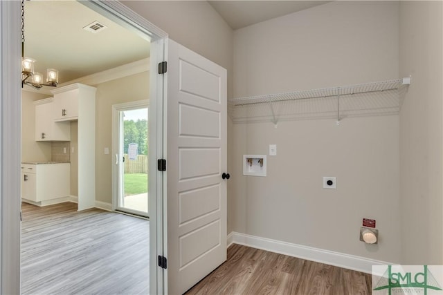 laundry room featuring baseboards, visible vents, hookup for a washing machine, hookup for an electric dryer, and light wood-style floors