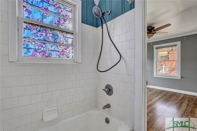 full bath with shower / washtub combination, crown molding, a ceiling fan, wood finished floors, and baseboards