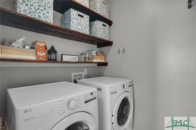 washroom with laundry area and washing machine and dryer