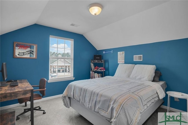 carpeted bedroom featuring vaulted ceiling, visible vents, and baseboards