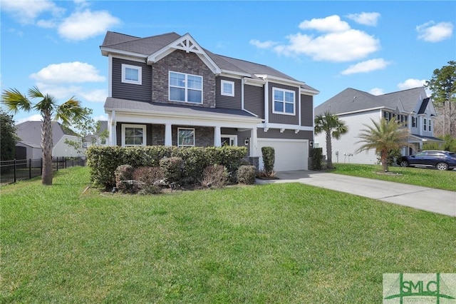 view of front of property featuring concrete driveway, an attached garage, fence, stone siding, and a front lawn