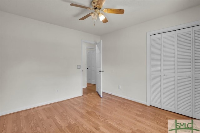 unfurnished bedroom with a ceiling fan, a closet, baseboards, and light wood finished floors