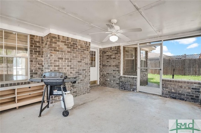 view of patio / terrace with ceiling fan, grilling area, and fence