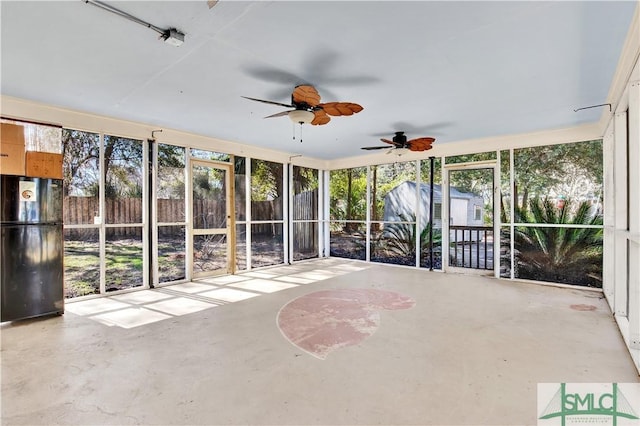 unfurnished sunroom featuring plenty of natural light