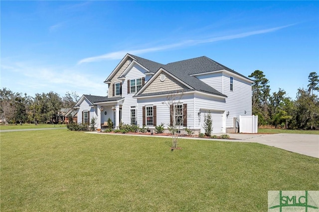 view of front of home featuring driveway, roof with shingles, and a front yard