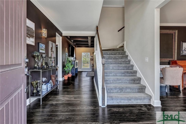 entrance foyer with baseboards, crown molding, stairway, and wood finished floors