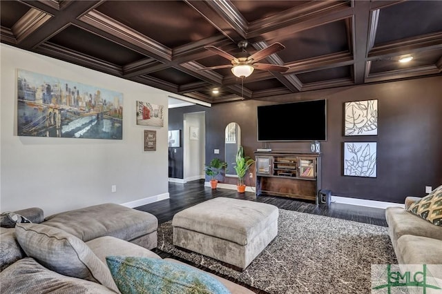 living area with ceiling fan, wood finished floors, baseboards, beamed ceiling, and crown molding