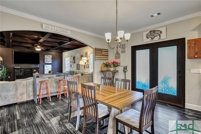 dining room featuring visible vents, arched walkways, coffered ceiling, ornamental molding, and dark wood-style flooring