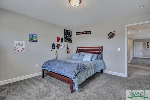 bedroom featuring attic access, carpet, and baseboards