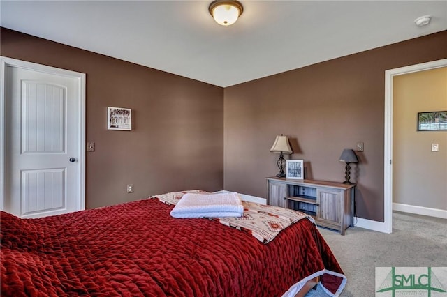 bedroom featuring carpet flooring and baseboards