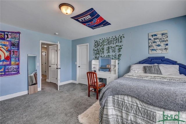 carpeted bedroom featuring baseboards