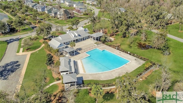 birds eye view of property with a residential view