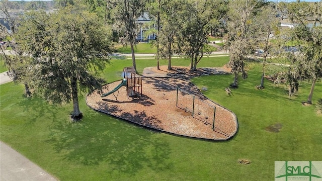 view of home's community with playground community and a lawn