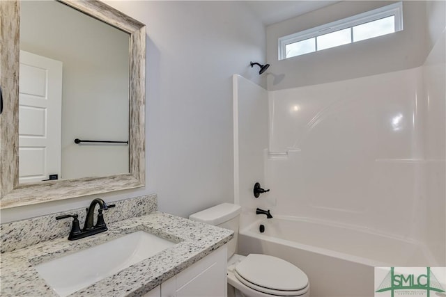 full bath featuring toilet, bathtub / shower combination, and vanity