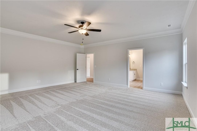 unfurnished bedroom with visible vents, baseboards, a ceiling fan, light colored carpet, and ornamental molding