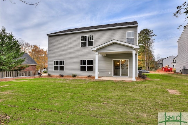 rear view of house featuring central AC, a lawn, a patio area, and fence