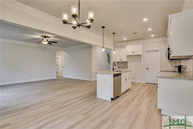 kitchen featuring visible vents, white cabinets, appliances with stainless steel finishes, ornamental molding, and a sink