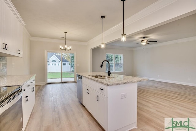 kitchen with stainless steel dishwasher, range with electric stovetop, a sink, and a healthy amount of sunlight