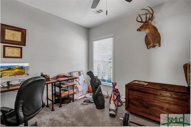 carpeted office with ceiling fan, visible vents, and baseboards