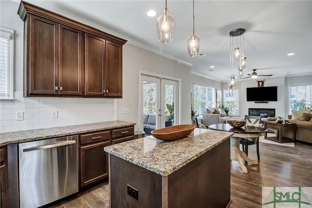 kitchen with french doors, dark wood finished floors, backsplash, stainless steel dishwasher, and dark brown cabinetry