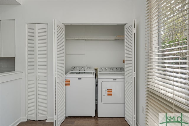 laundry area with washer and dryer, laundry area, and dark wood-style flooring