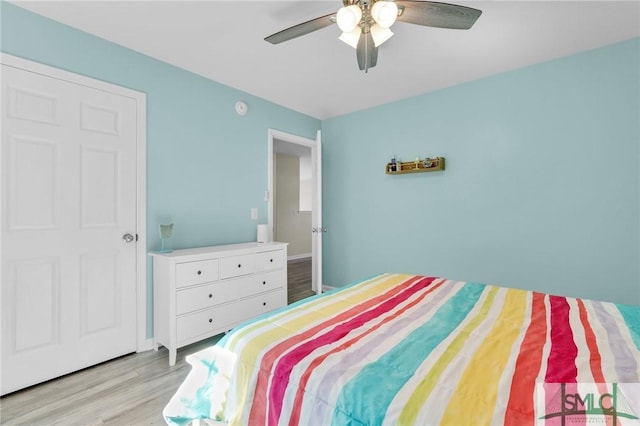 bedroom featuring a ceiling fan and light wood-style floors